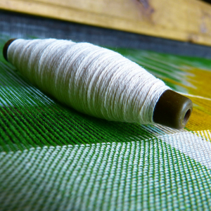 Illustration représentant une bobine de fil de soie